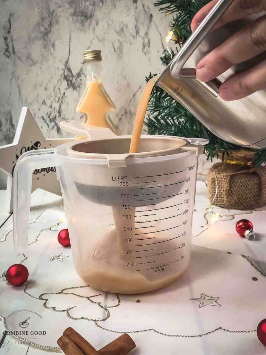 Fine strain the spiced apple cider into a jug.