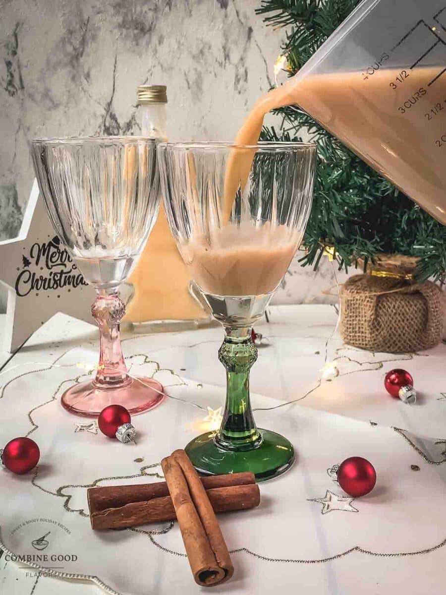 Divide the spiced apple cider between the serving glasses.