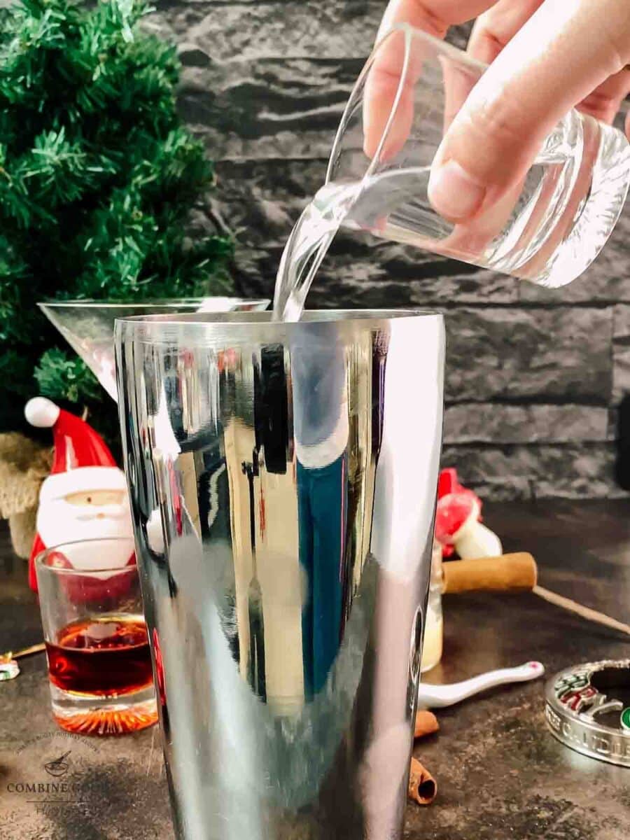 Add vanilla vodka to the cocktail shaker.
