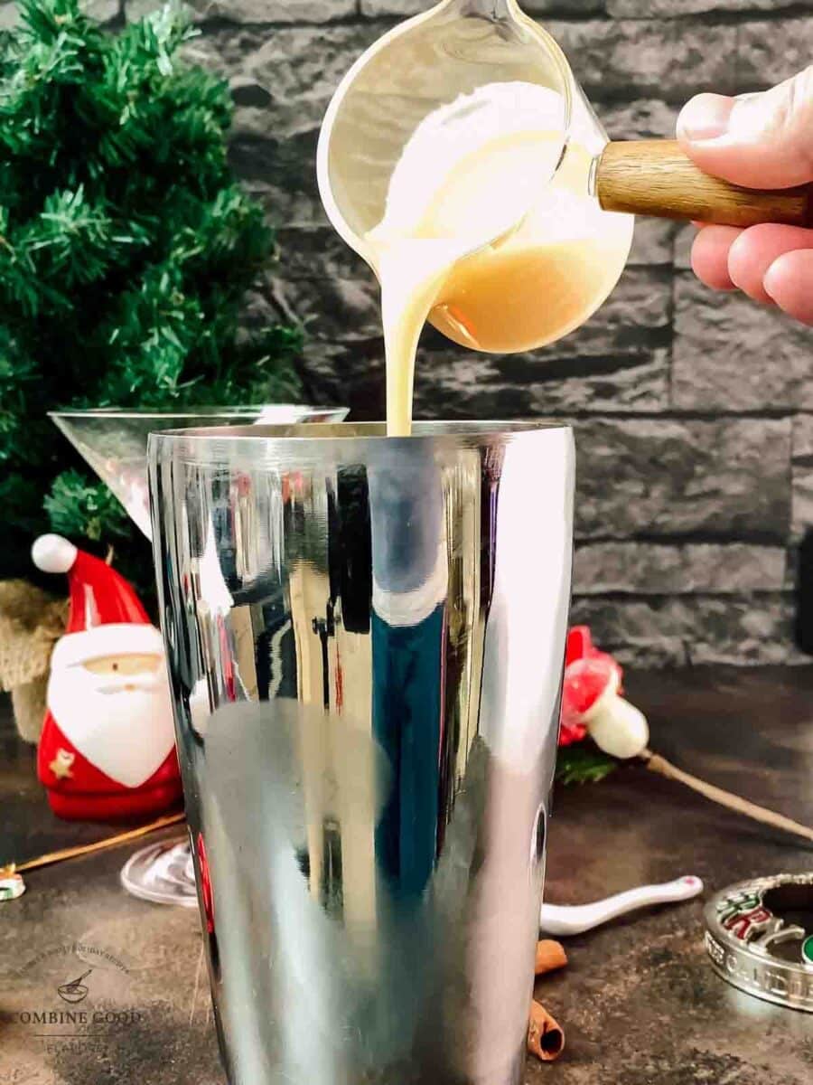 Add egg liqueur to the cocktail shaker.