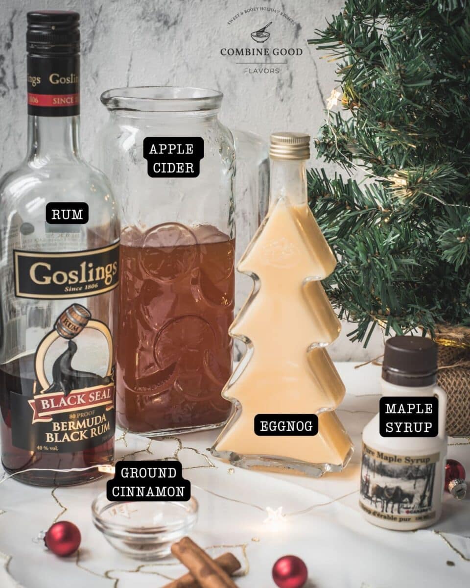 Spiced apple cider ingredients - rum, eggnog, cinnamon, maple syrup