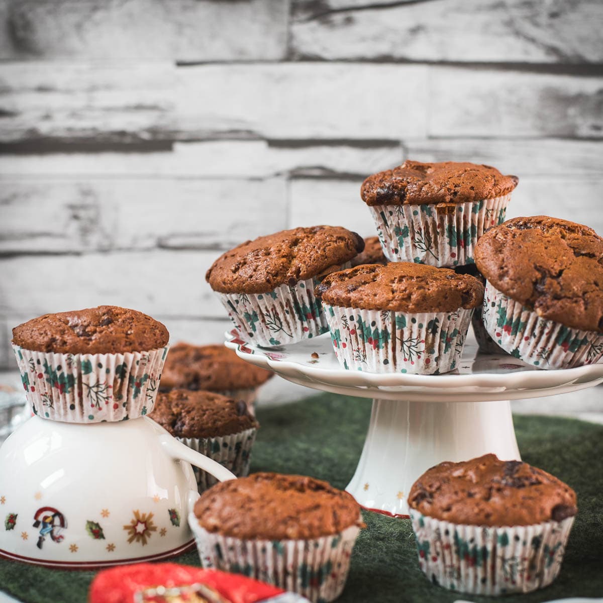Delicious St. Nicholas chocolate muffins, placed one christmassy plates.