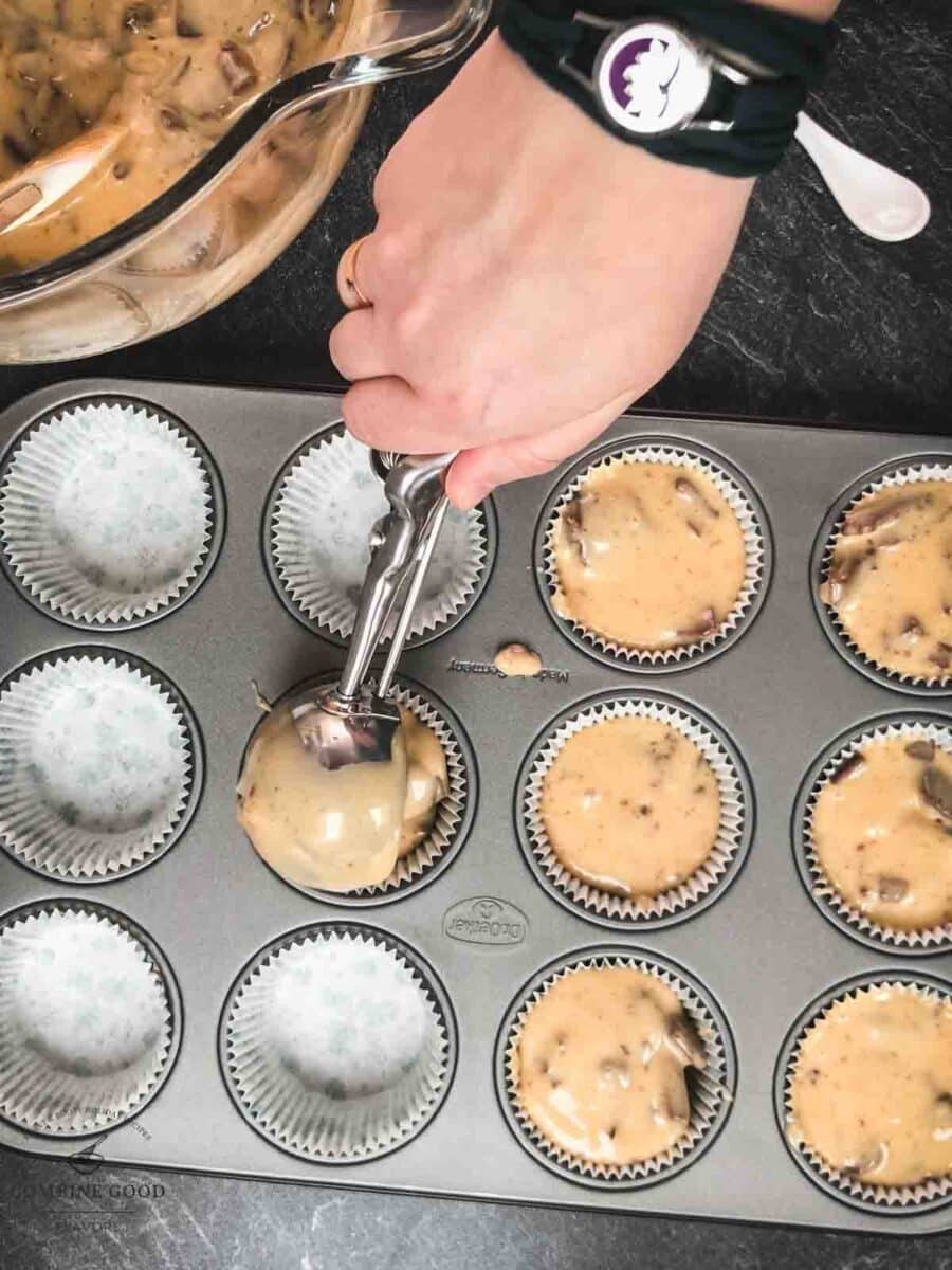 Scoop the dough into the prepared muffin tins.