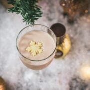 Divine rum alexander cocktail, garnished with a white chocolate snowflake.