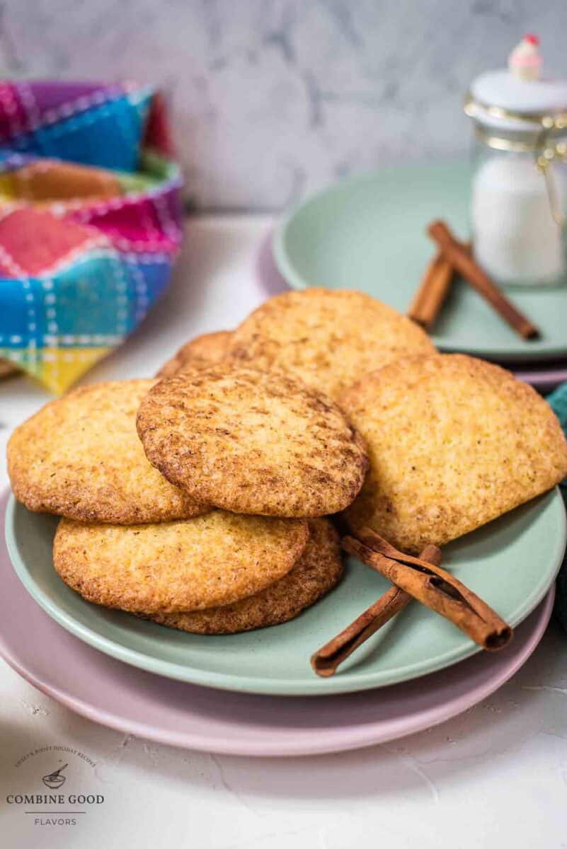 Fluffy snickerdoodle cookies placed on multicolored plates.