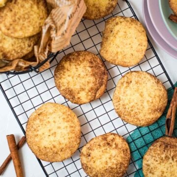 Fluffy snickerdoodle cookies placed on cooling rack.