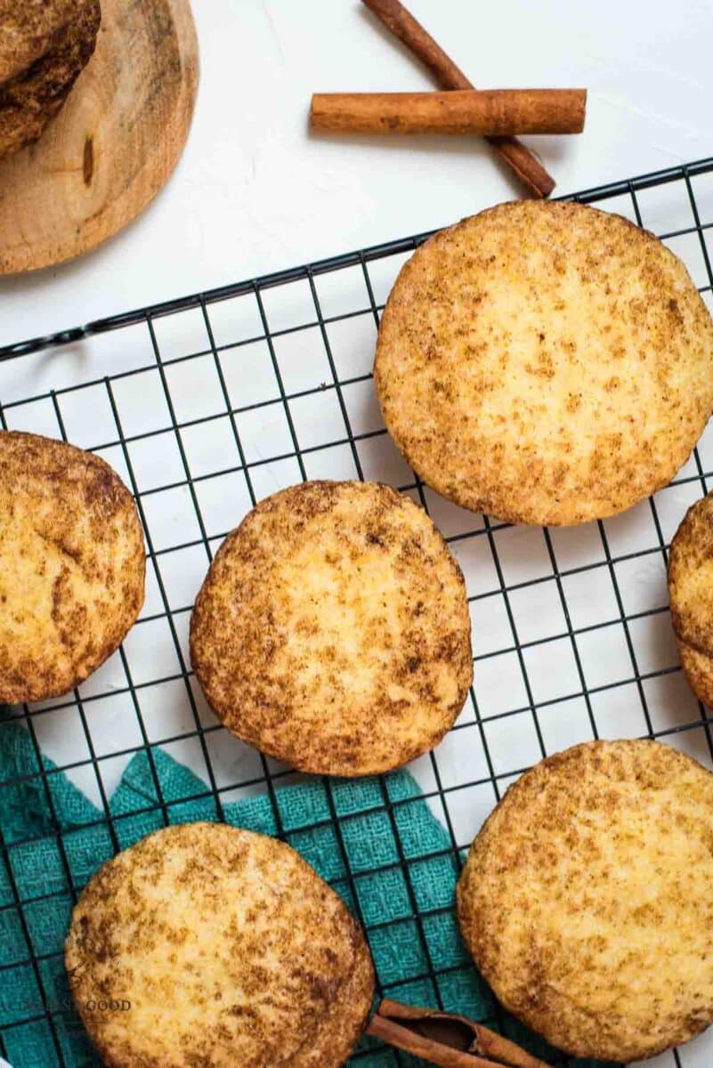 Fluffy snickerdoodle cookies placed on cooling rack.