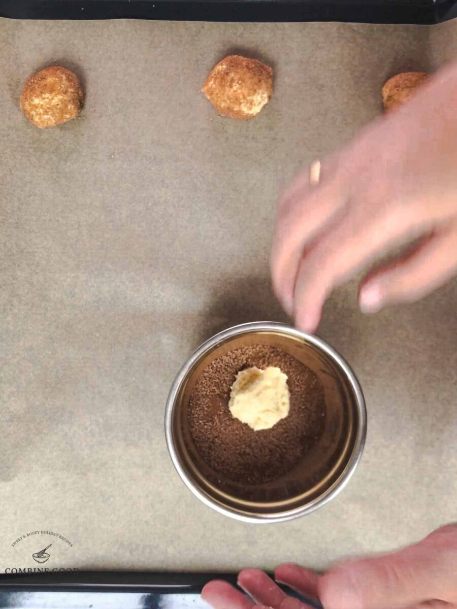 Place the dough ball into the sugar cinnamon mixture.