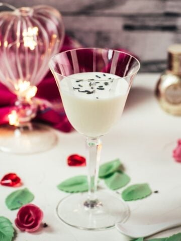 Elegant Gin Alexander, garnished with lavender buds. Perfect for Valentine's Day!