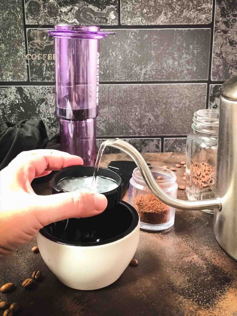 Rinse the filter paper with hot water.