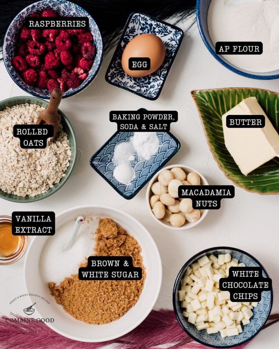 Raspberry macadamia oatmeal white chocolate chip cookies ingredients - raspberries, egg, ap flour, rolled oats, butter, vanilla extract, brown and white sugar, white chocolate chips/chunks, macadamia nuts, baking powder, baking soda, and salt.