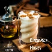 Gorgeous honey cinnamon latte, garnished with stencil made cute little coffee bean shapes.