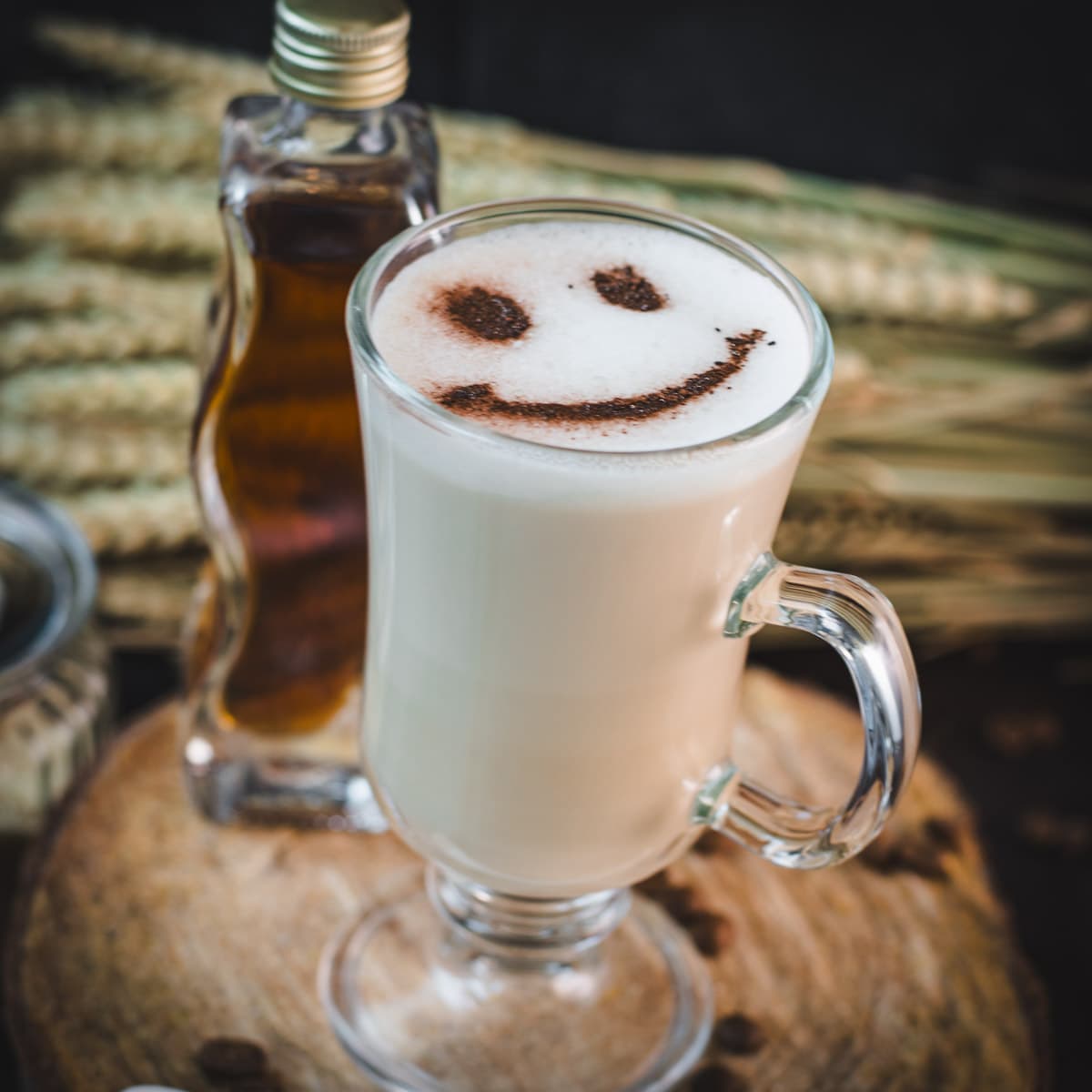 Cute brown sugar oat milk coffee, with a smiley face dusted on top of it.