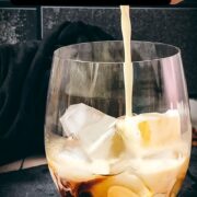 Simple GT glass, filled with delicious brown sugar white Russian. Placed on a black slate plate.