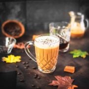 Delicious caramel coffee with homemade caramel milk, served in beautiful glass mug.