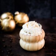 Delicious iced eggnog latte, garnished with heavy cream and dusted with ground cinnamon.