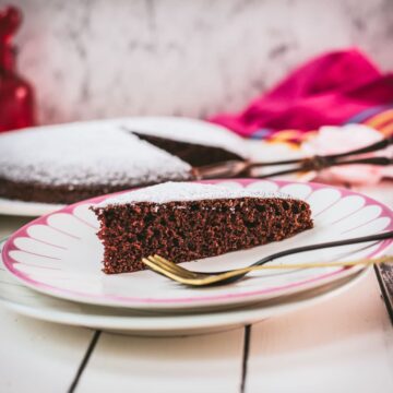 Delicious Valentine's chocolate cake slice, dusted with powdered sugar. Ideal for Valentine's day!