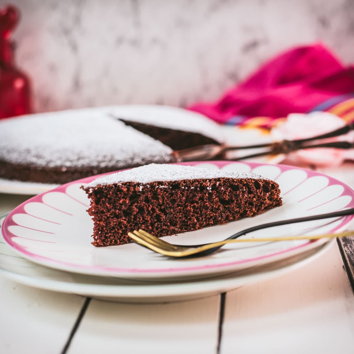 Delicious Valentine's chocolate cake slice, dusted with powdered sugar. Ideal for Valentine's day!
