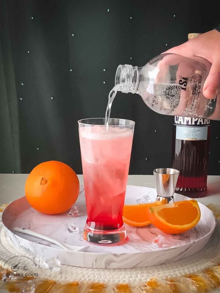 Top the Campari with soda water.