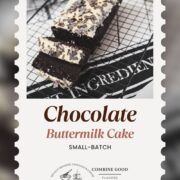Divine chocolate buttermilk loaf cake with white chocolate frosting, sprinkled with chocolate shavings.