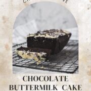 Divine chocolate buttermilk loaf cake with white chocolate frosting, sprinkled with chocolate shavings.