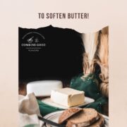 Cube of butter, placed on white plate with brown colored rim, next to a plate with sliced bread.