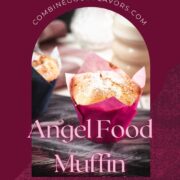 Cute angel food muffins, dusted with powdered sugar, placed on marbled plate and served with a delicious cafe latte.