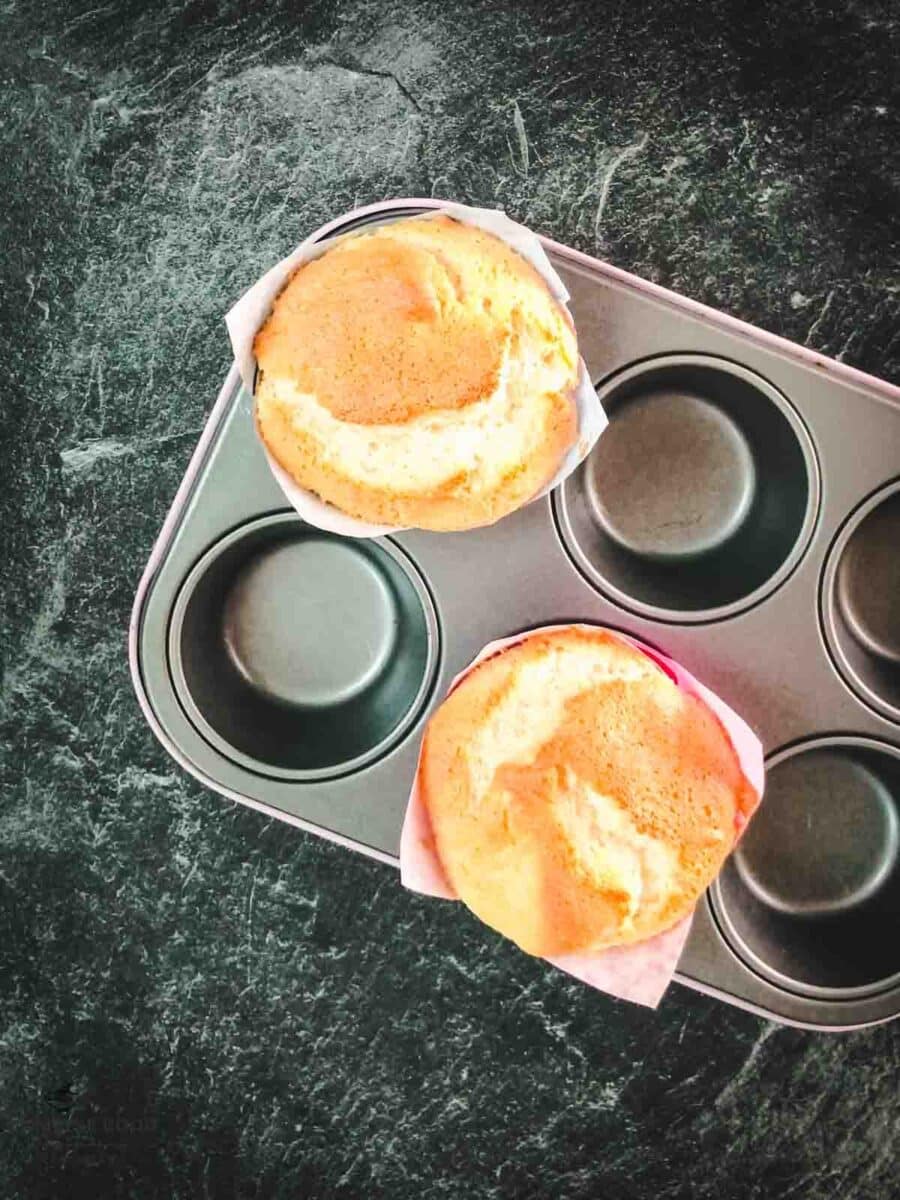 Angel food muffins in muffin tin after baking.