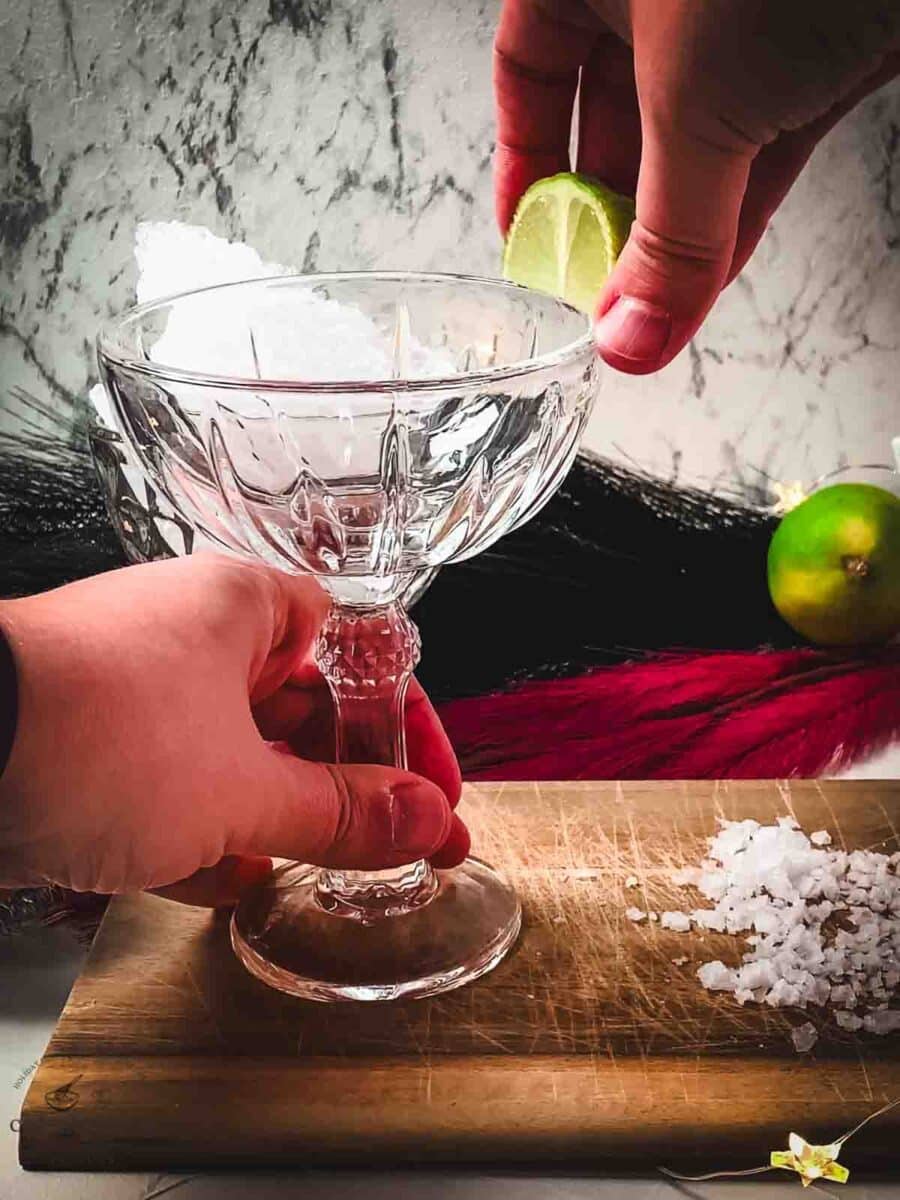 Run a lime wedge halfway around the rim of your cocktail glass.