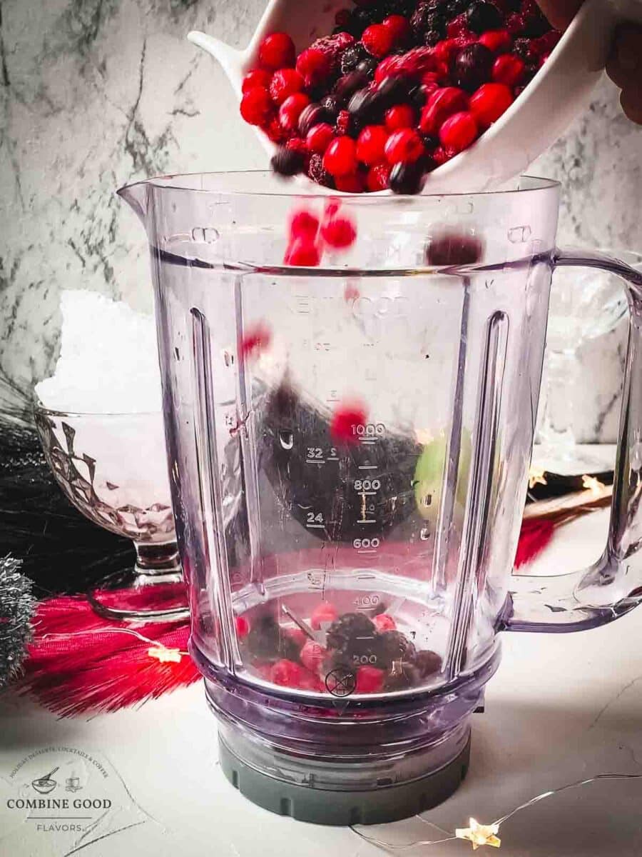 Add the frozen berry mix to your blender.