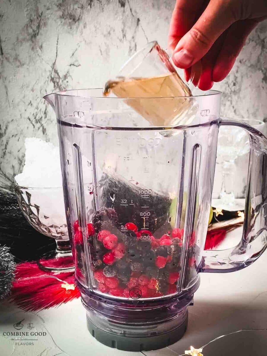 Add raspberry liqueur to your blender.