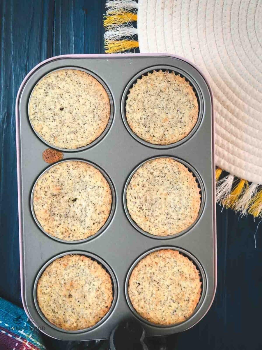 Baking tray, filled with lemon poppy seed muffins after baking.