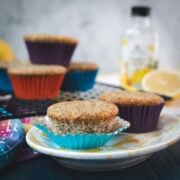 Lemon poppy seed muffins, placed on gorgeous yellow white plate.