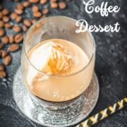 This photo shows a glass with an affogato, featuring a scoop of vanilla ice cream floating in espresso.