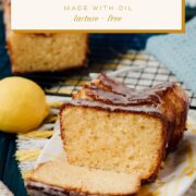Sliced lemon loaf cake, placed on white and yellow plate, next a lemon.