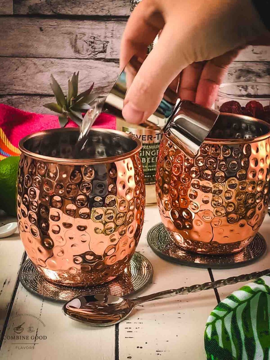 Add vanilla vodka to the copper mug.