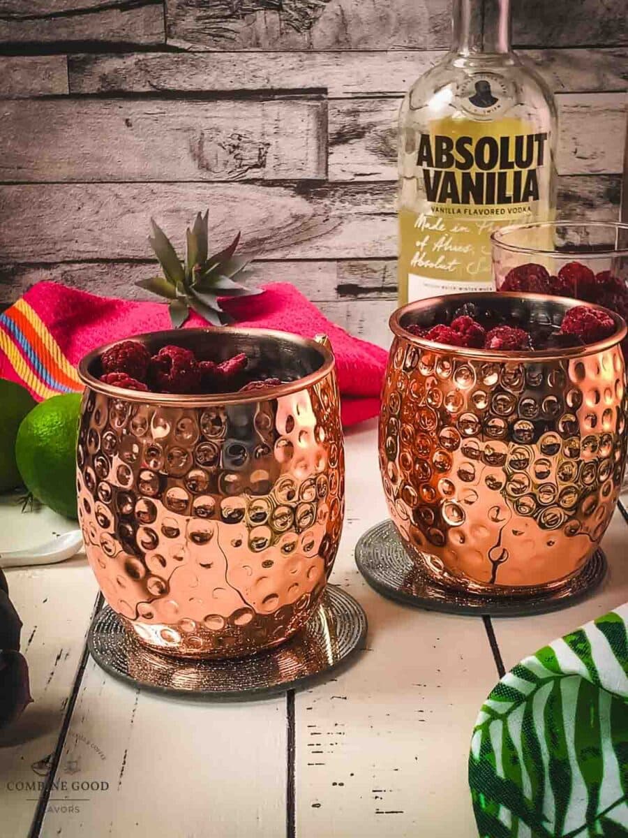 Top the raspberry mule with frozen raspberries.