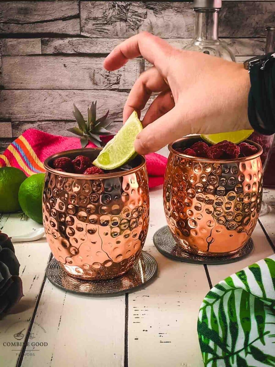 Garnish the raspberry mule with a lime wedge.