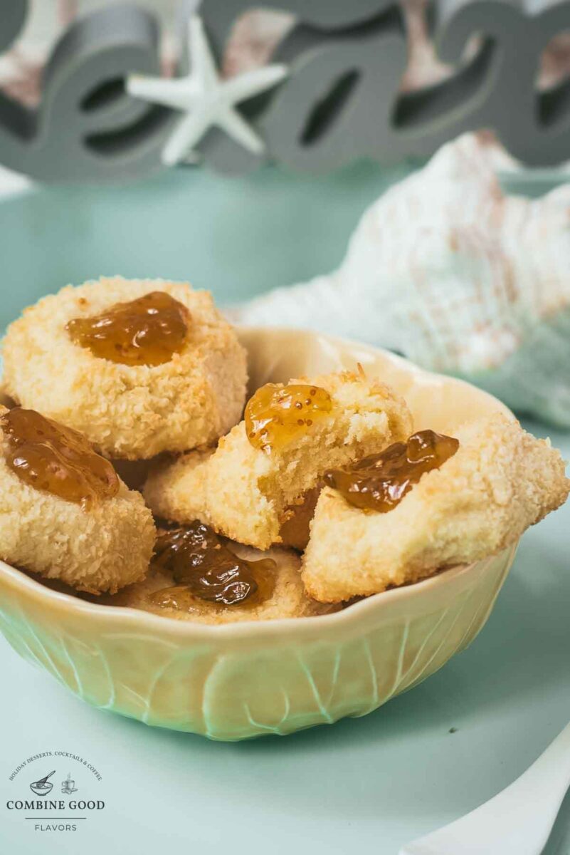 Delicious fig jam cookies, placed in a yellow bowl, on cookie is already missing a bite.