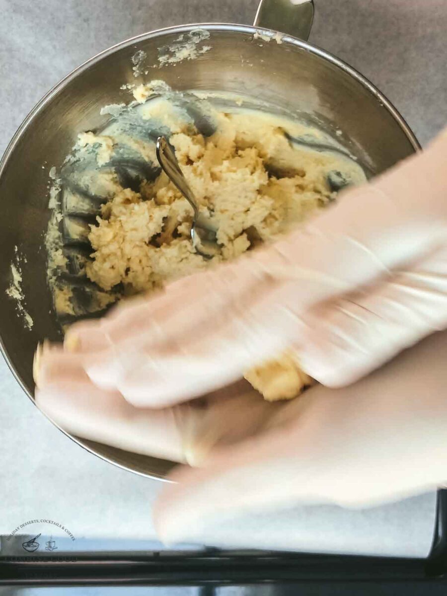 Roll the cookie dough between your hands to form a ball.