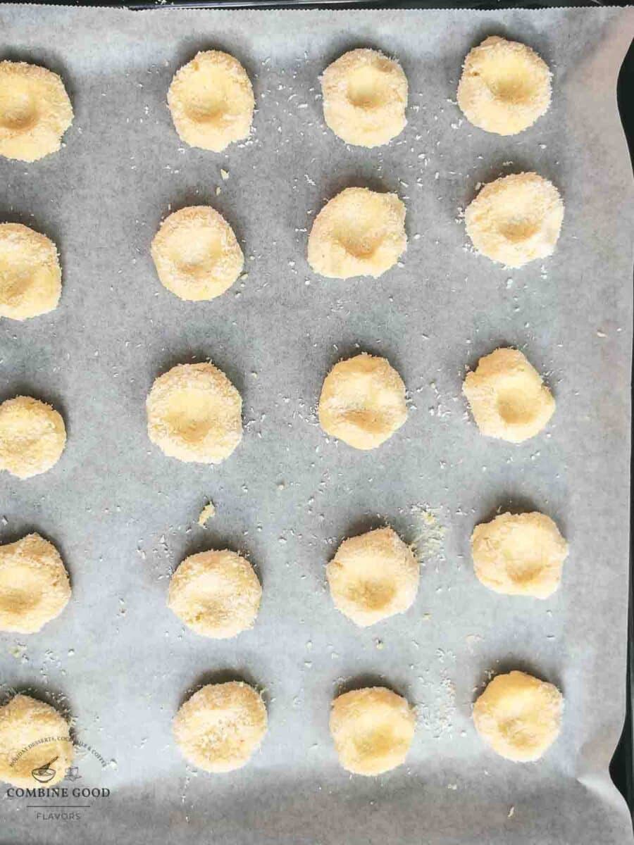 Fig jam coconut cookies placed on baking sheet prior baking.