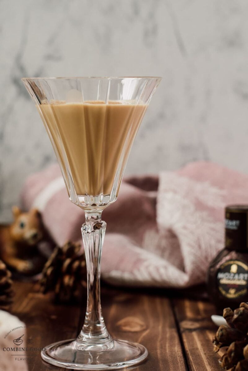 Dark chocolate Brandy Alexander beside a bottle of Mozart Dark Chocolate Liqueur