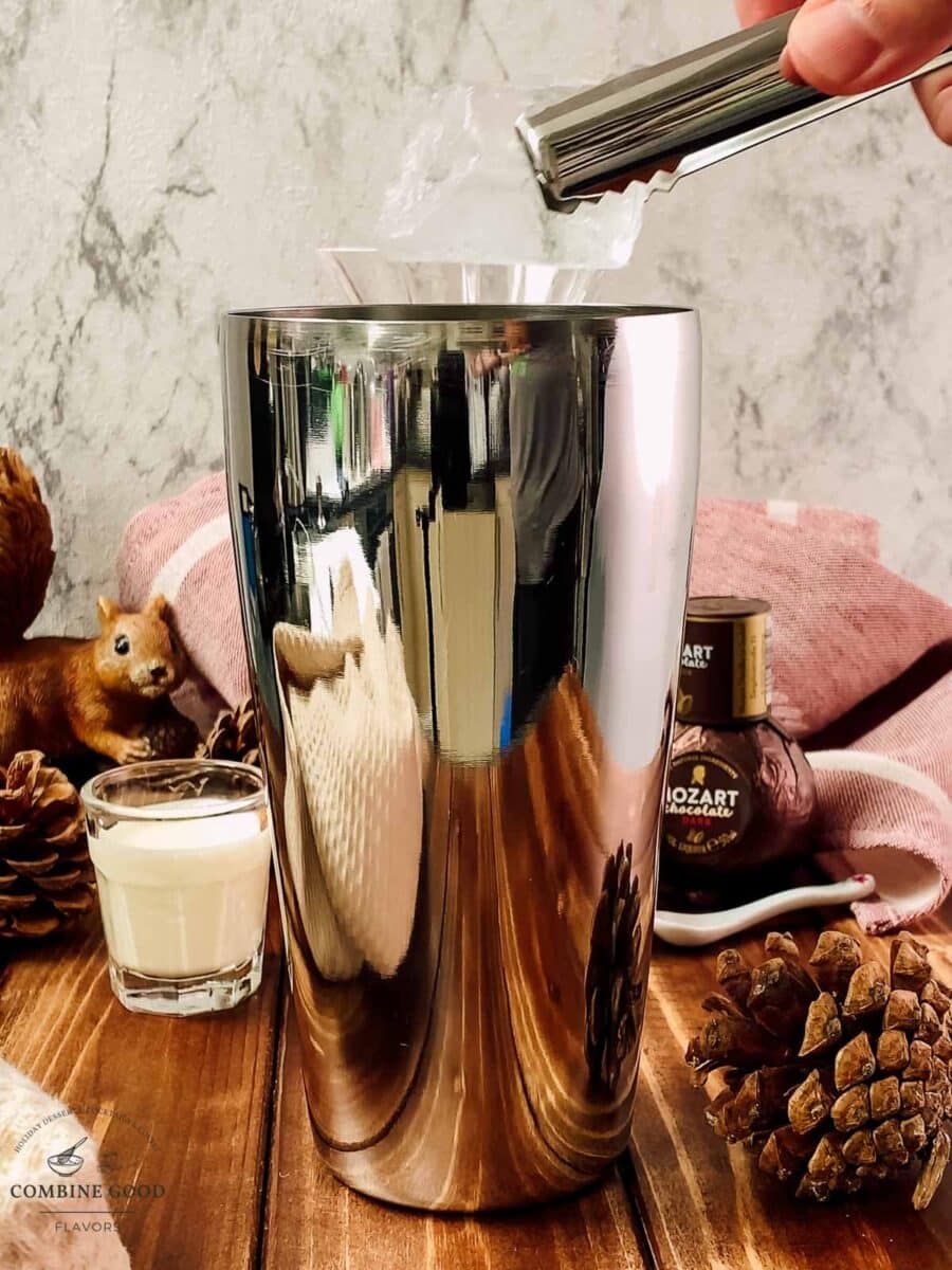 Cocktail shaker filled with ice for a Brandy Alexander