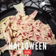 Stunning and elegant - this Halloween bark, made with crushed raspberries, white chocolate, and berry blood syrup is to die for!