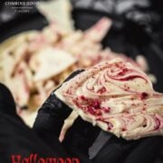Stunning Halloween bark, held in black gloved hand.