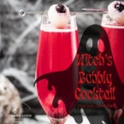 Spooky red Halloween cocktails, garnished with lychee eyeballs and served in a spooky location.