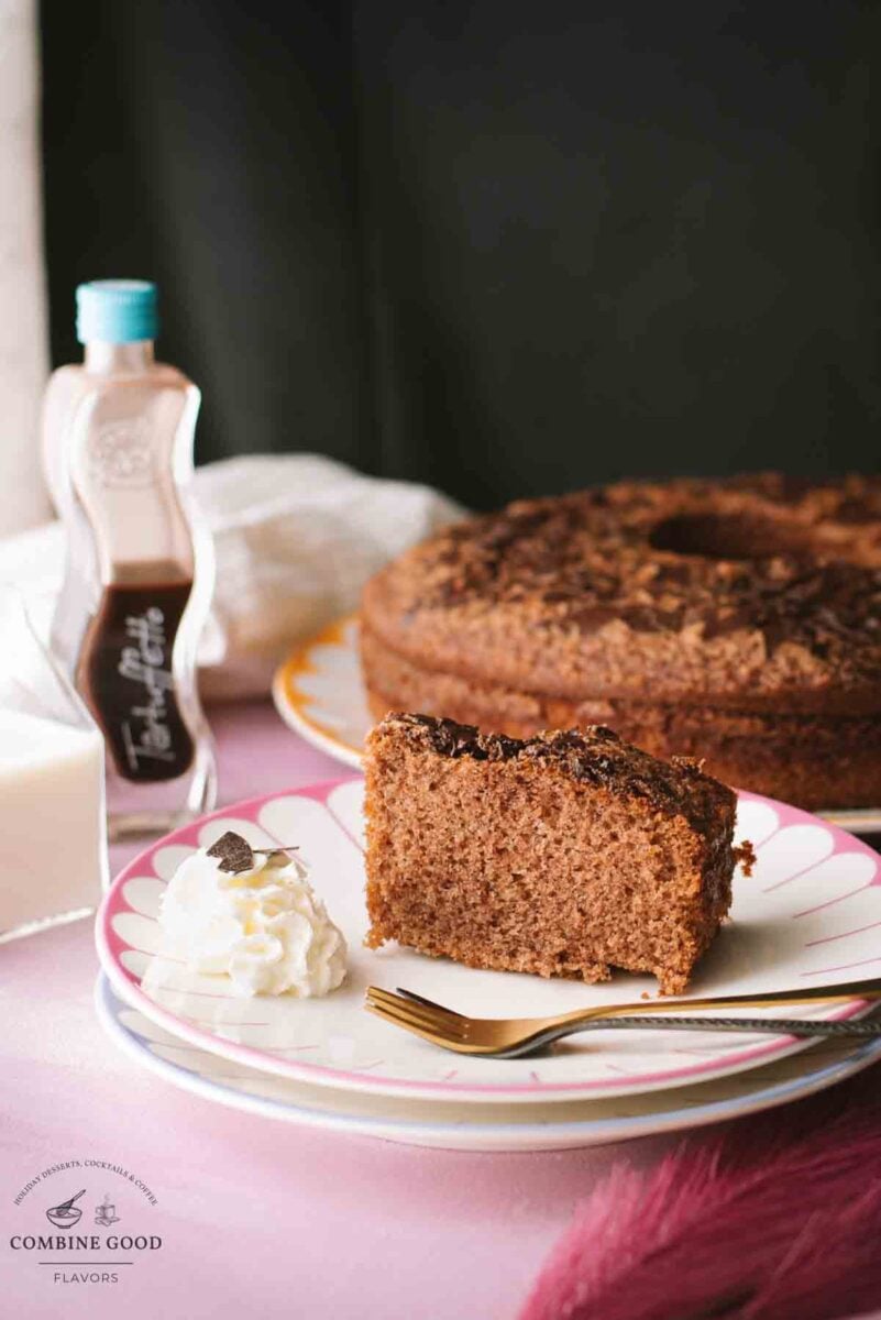 Fluffy chocolate cum cake with potato starch and chocolate rum liqueur. A slice placed on a beautiful, colorful plate.
