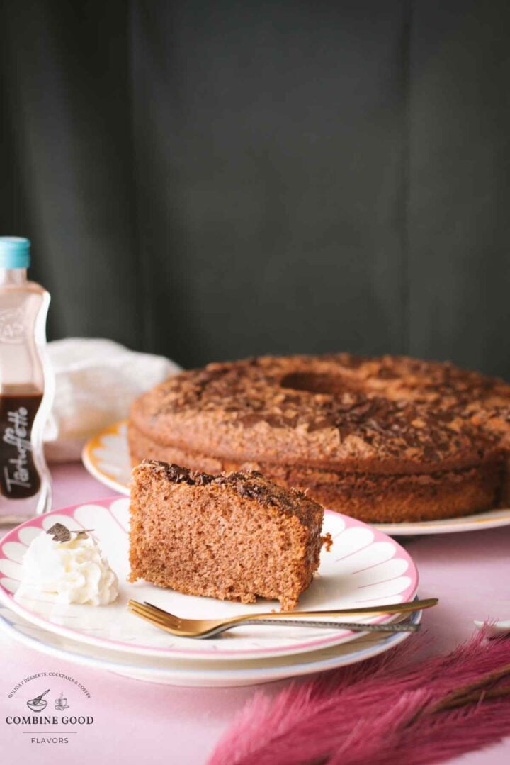 Fluffy chocolate cum cake with potato starch and chocolate rum liqueur. A slice placed on a beautiful, colorful plate.