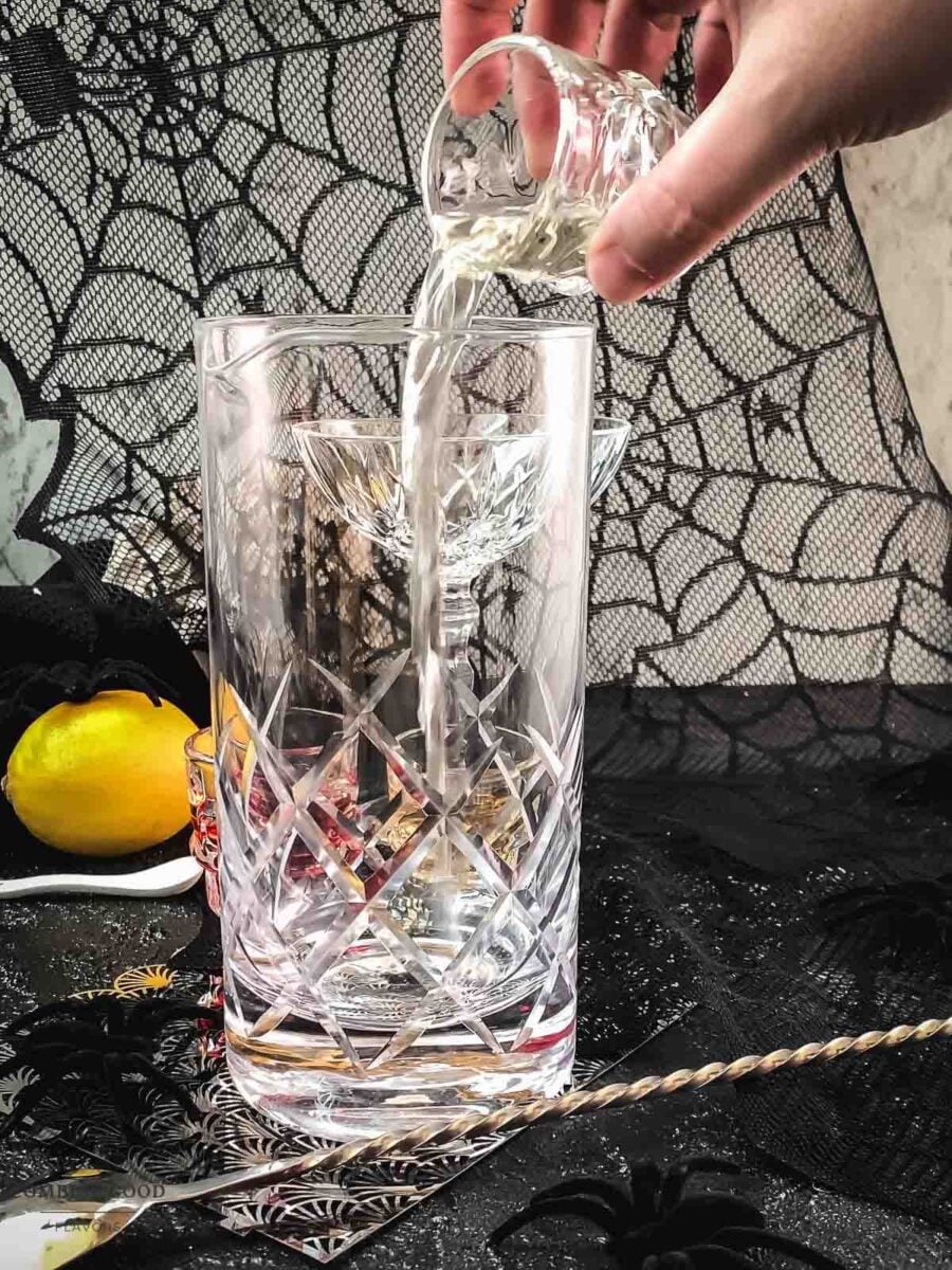 Add dry vermouth to the mixing glass.