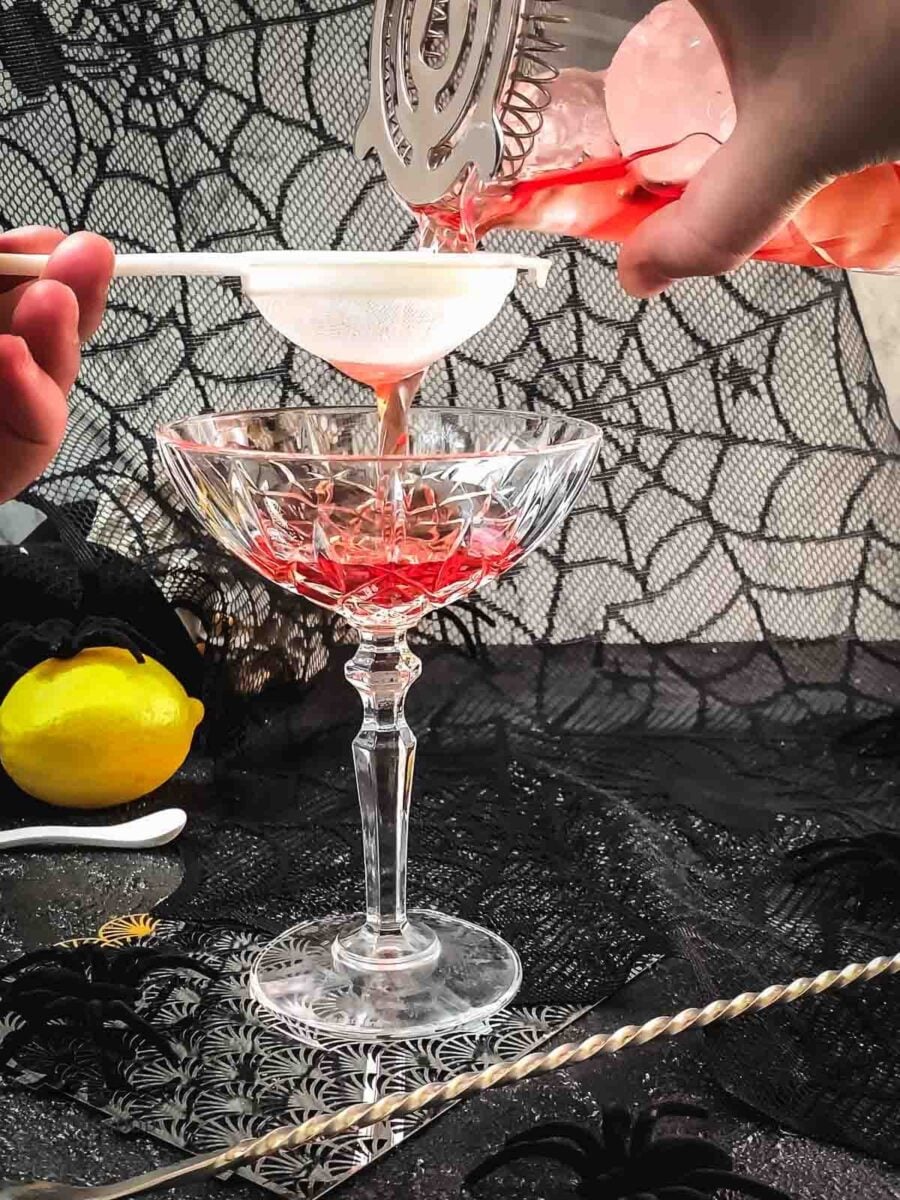 Fine strain the cocktail into the serving glass.